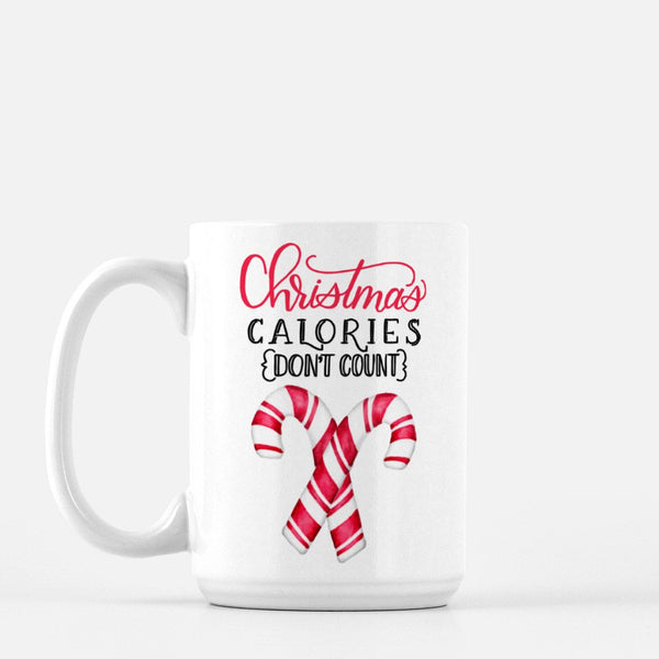 15oz white ceramic mug with watercolor candy canes and says christmas calories don't count