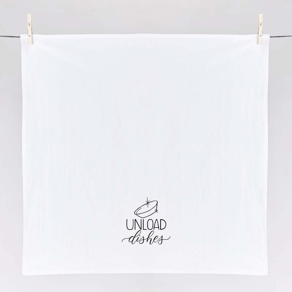 White floursack towel with black hand lettered illustrated design that says Unload dishes with a clean bowl doodle shown unfolded and hanging from clothes pins