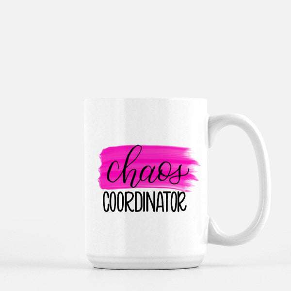 15oz white ceramic mug with hand lettered illustrated design that says chaos coordinator with a pink paint swash