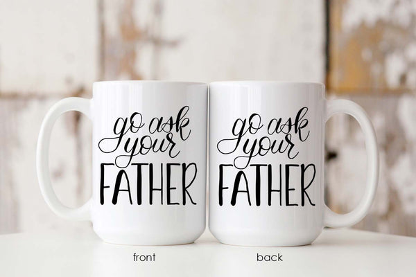 15oz white ceramic mug with hand lettered illustrated design that says go ask your father showing both front and back of mug