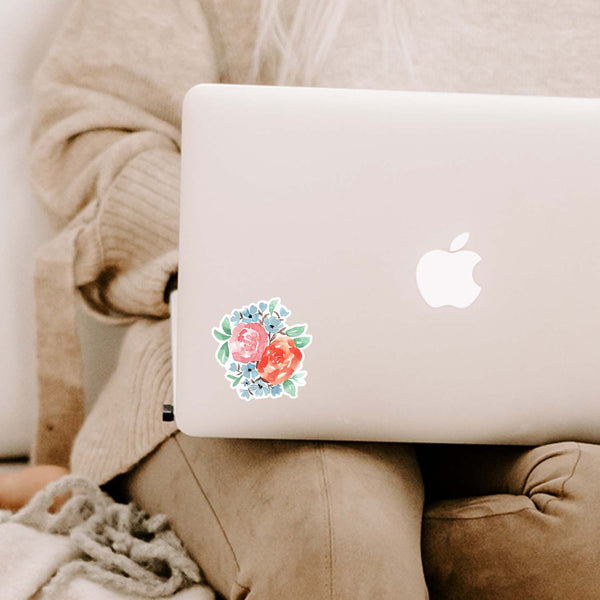 3" Autumn Floral Vinyl Sticker in blue, green, coral and pink shown on an apple laptop laying on a woman's lap
