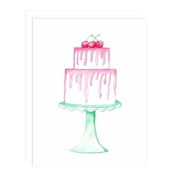 Notecard with a watercolor painting of a 2 tiered white cake with dripping pink frosting topped with 3 cherries and sitting on a seafoam green scalloped cake stand.