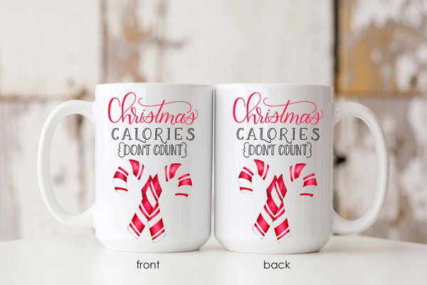 15oz white ceramic mug with watercolor candy canes and says christmas calories don't count showing front and back of mug side by side