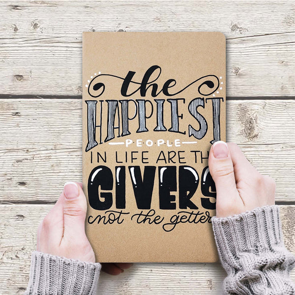 Hand painted gift giving/tracking journal that says the happiest people in life are the givers not the getters shown with women's hand  holding