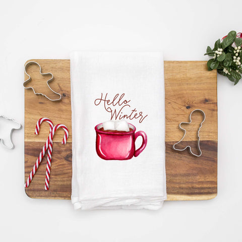Floursack Kitchen Tea Towel with a watercolor painted red mug full of cocoa and marshmallows that says Hello Winter