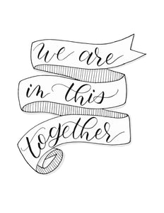 wall art that says we are in this together inside a folding ribbon illustration