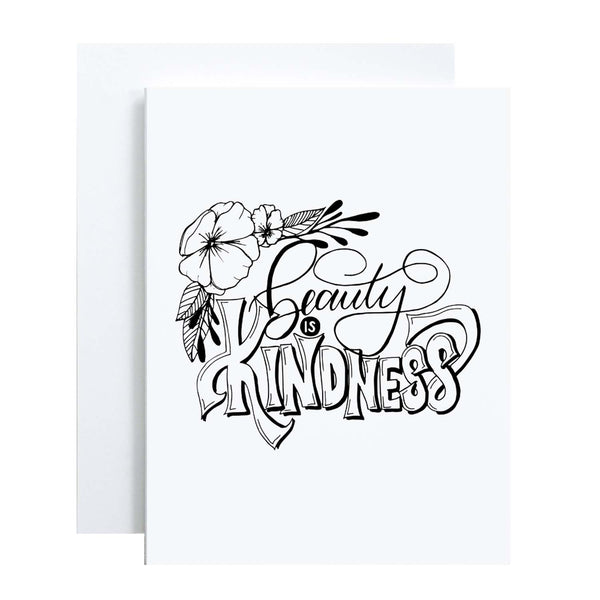 Beauty is kindness hand lettered and illustrated black and white greeting card on a folded white card with an A2 envelope