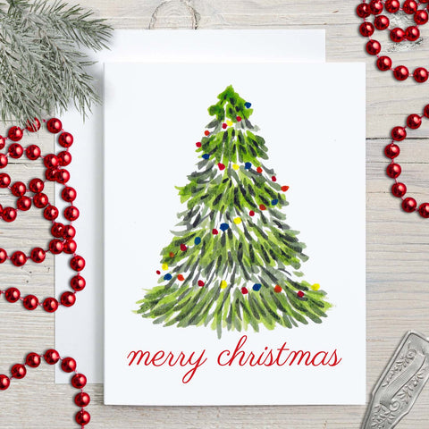 Merry Christmas greeting card with a watercolor Christmas tree with colorful lights and merry christmas message shown with christmas decor