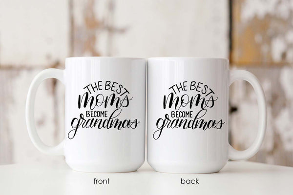 15oz white ceramic mug with hand lettered illustrated design that says the best moms become grandmas showing both the front and back of the mug