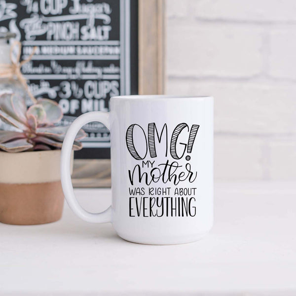 15oz white ceramic mug with hand lettered illustrated design that says OMG! My mother was right about everything shown in a kitchen