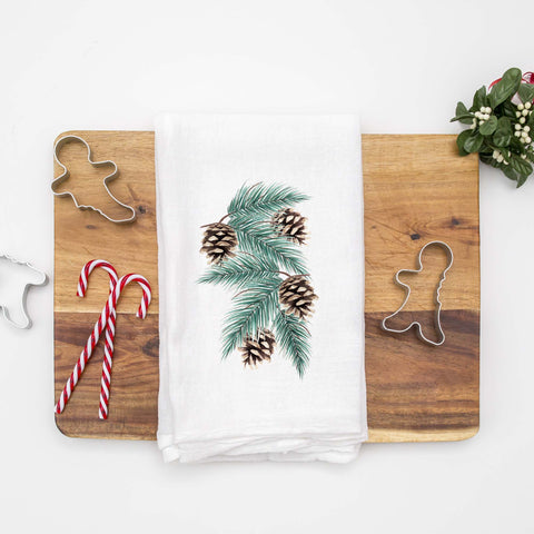 Floursack Kitchen Tea Towel with watercolor evergreen branches and pinecones