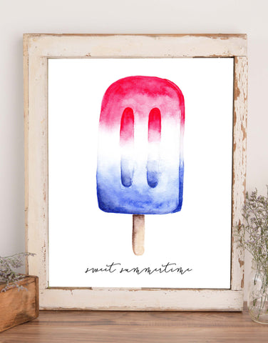 Wall art of a red white and blue popsicle and says sweet summertime in black