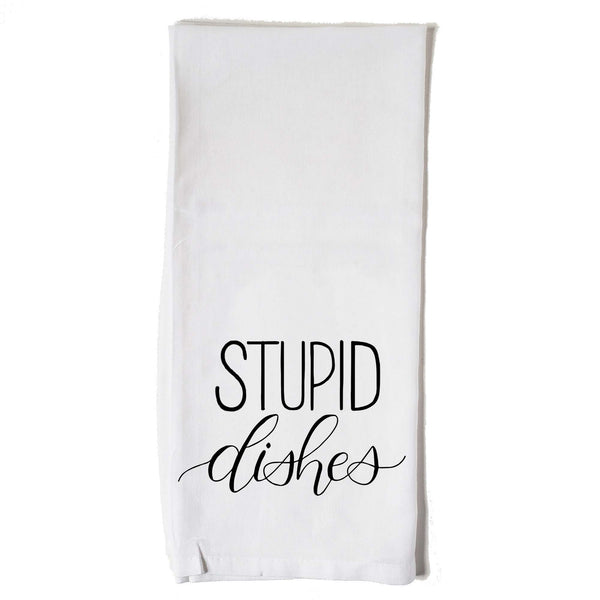 White floursack towel with black hand lettered illustrated design that says Stupid dishes