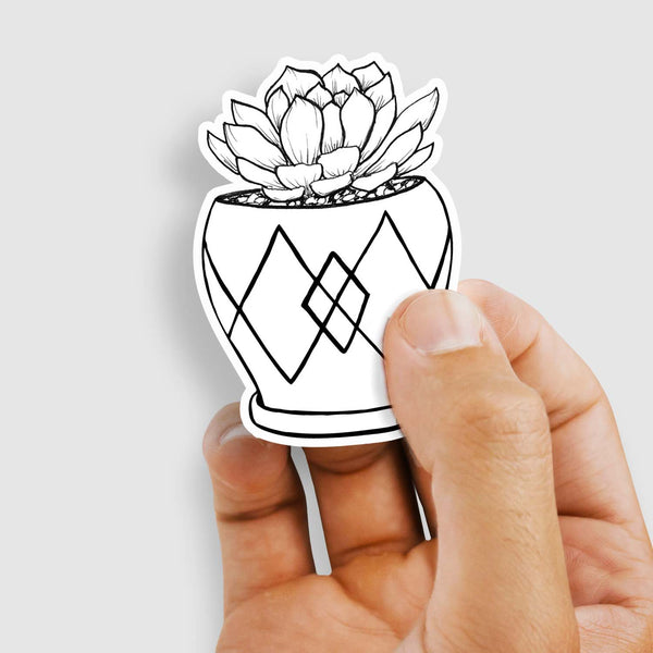 3" black and white hand illustration of a succulent plant in a mini pot shown with a woman's hand holding the sticker