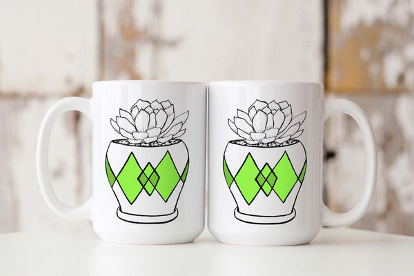 15oz white ceramic mug with hand lettered illustrated design of a succulent plant in a pot with green diamond pattern showing both front and back of the mug