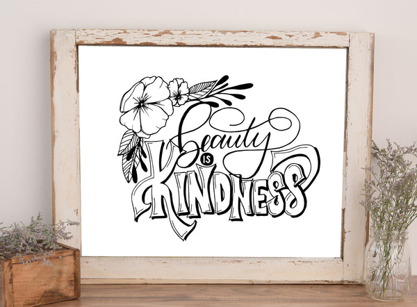 wall art that says beauty is kindness with floral illustrations in black and white