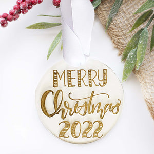 Custom Round clear acrylic ornament personalized with own message and year in hand lettering with a white silk ribbon