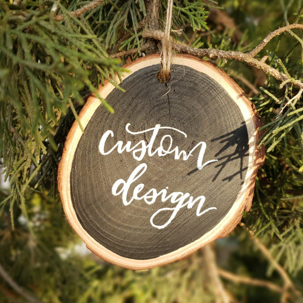rustic wood slice ornament can be customized with any design hanging on a tree