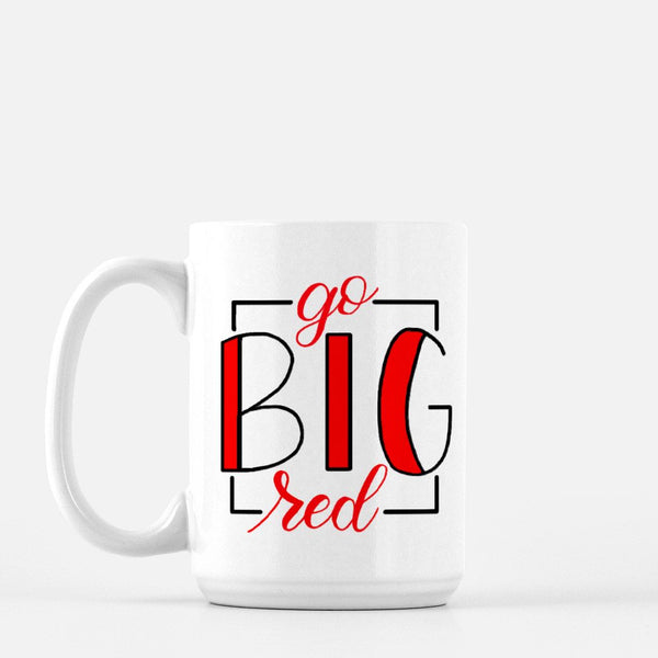 15oz white ceramic mug with hand lettered illustrated design that says Go Big Red