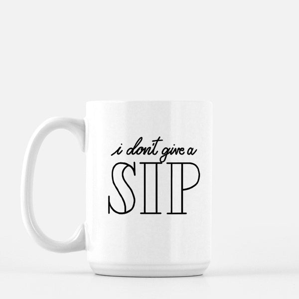 15oz white ceramic mug with hand lettered illustrated design that says I don't give a sip