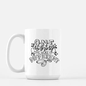 15oz white ceramic mug with hand lettered illustrated design that says One morning she woke up different