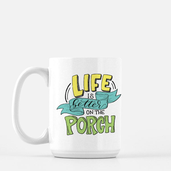 15oz white ceramic mug with hand lettered illustrated design that says Life Is Better On The Porch