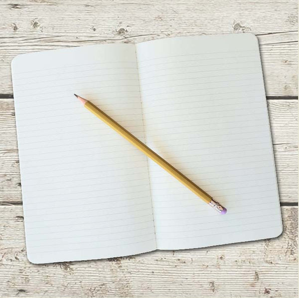 image of inside of journal with lined pages and a pencil